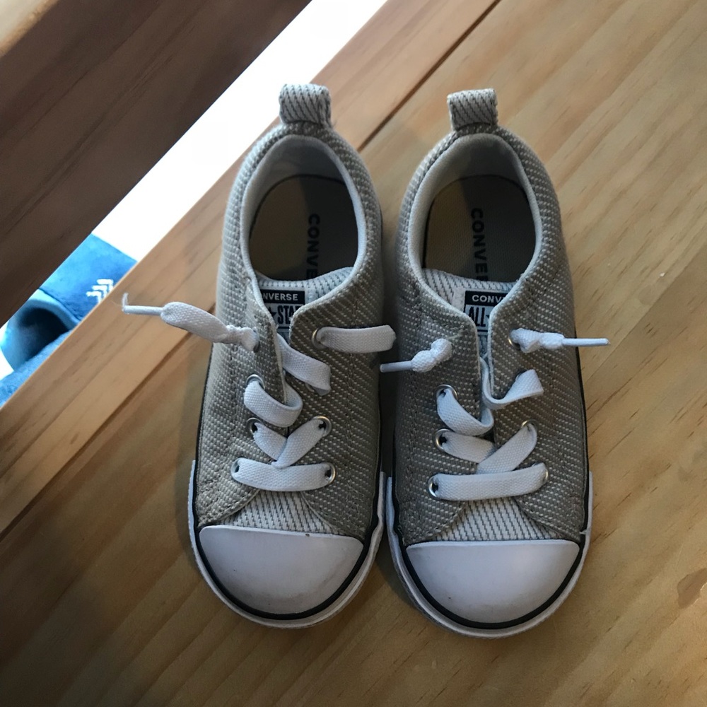 Tan and white converse